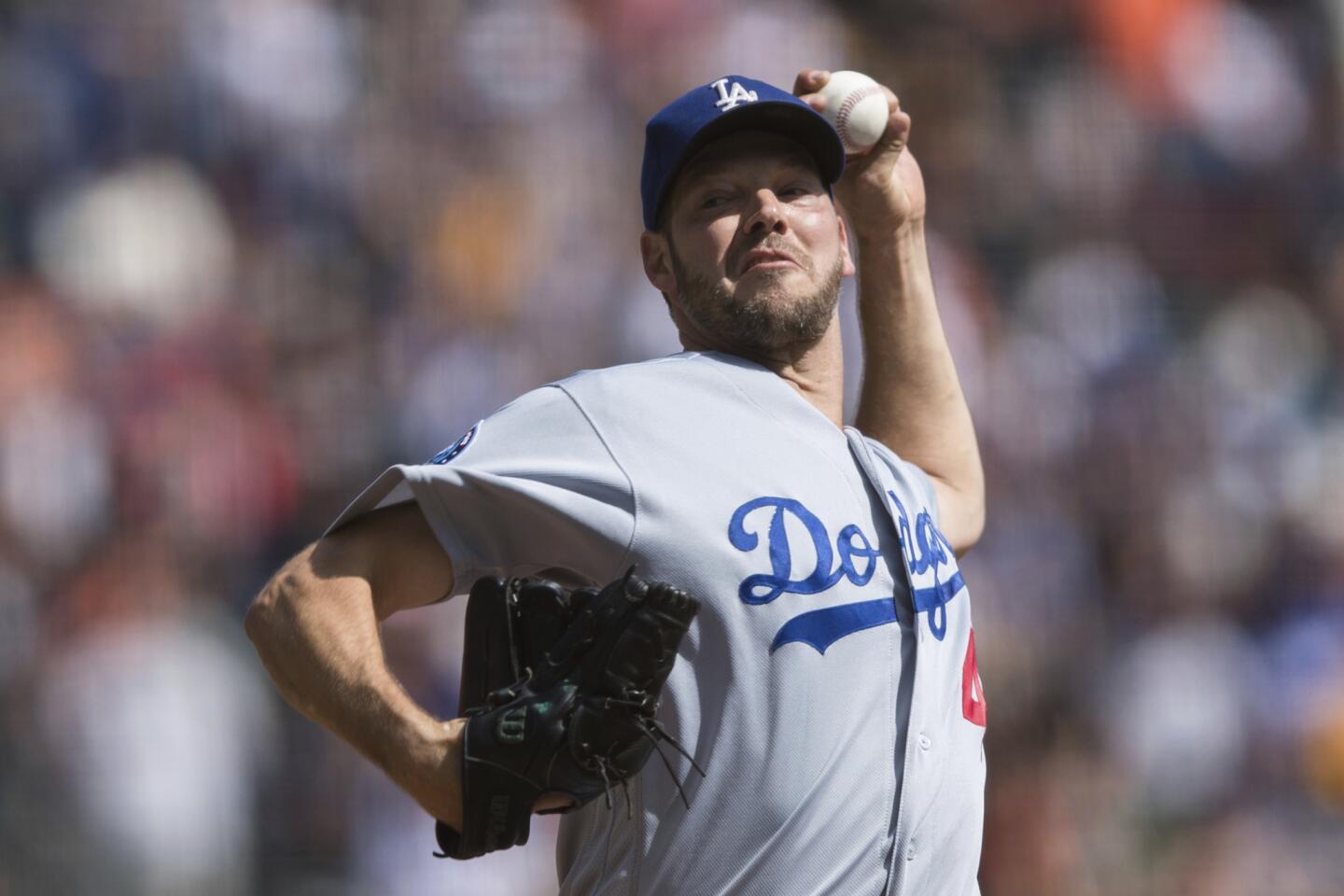 Los Angeles Dodgers starting pitcher Rich Hill throws against the San Francisco Giants in the second inning of a baseball game in San Francisco, Sunday, Sept. 30, 2018.