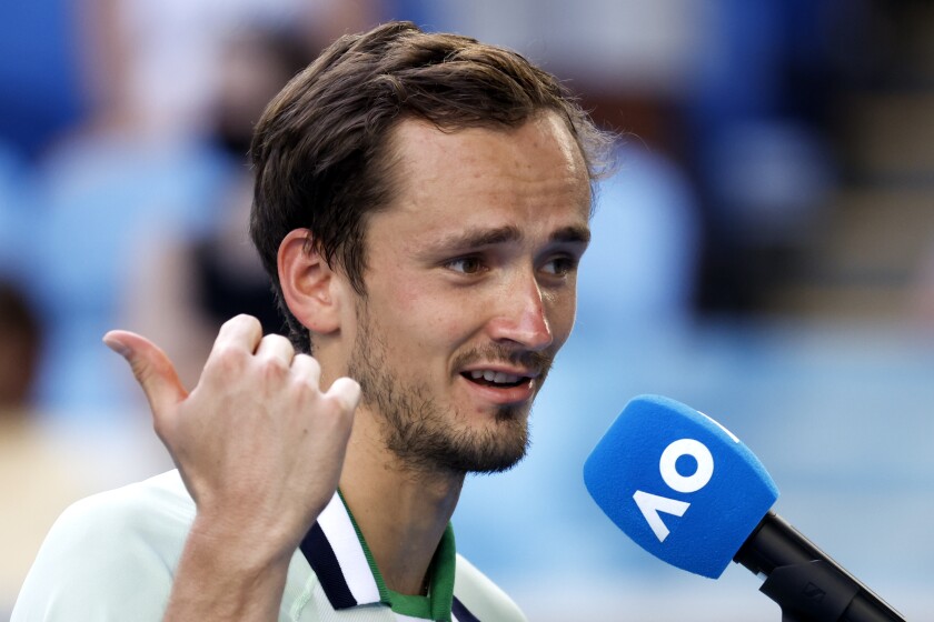 Daniil Medvedev of Russia gestures as he is interviewed after defeating Maxime Cressy of the U.S. following their fourth round match at the Australian Open tennis championships in Melbourne, Australia, Monday, Jan. 24, 2022. (AP Photo/Hamish Blair)