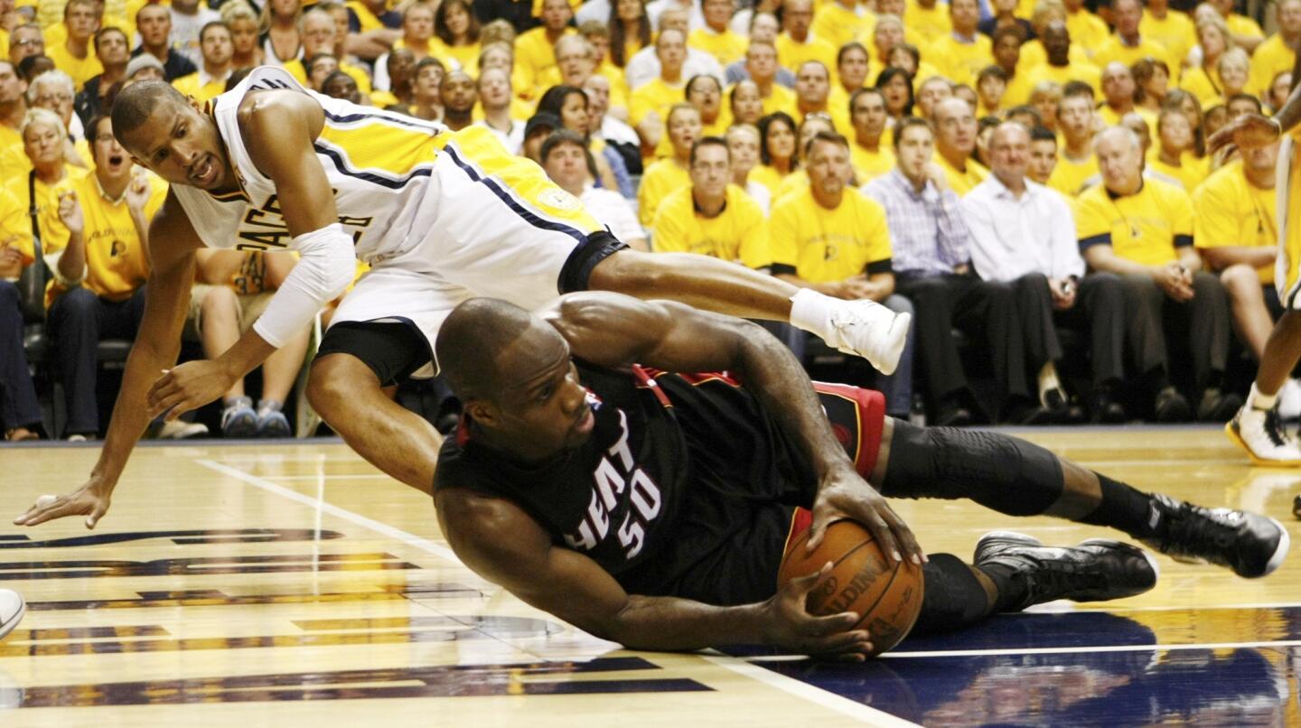 Indiana Pacers' West and Miami Heat's Anthony scramble for the ball during the fourth quarter of Game 6 of their NBA Eastern Conference second round basketball playoff series in Indianapolis