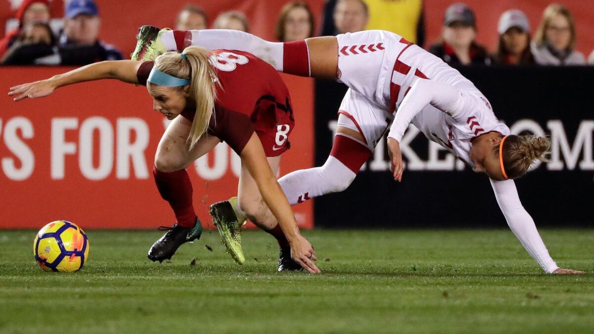 United States midfielder Julie Ertz, left, battles Denmark midfielder Sanne Troelsgaard for the ball during the second half of an international friendly soccer match.