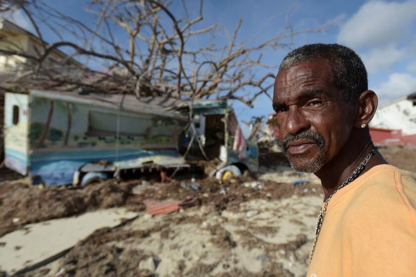 Juan Antonio Higuey shows his destroyed home at Cold Bay community after the passage of Hurricane Irma, in St. Martin, Monday, September 11, 2017. Irma cut a path of devastation across the northern Caribbean, leaving thousands homeless after destroying buildings and uprooting trees. (AP Photo/Carlos Giusti)