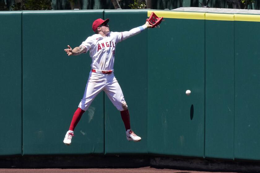 Los Angeles Angels center fielder Mickey Moniak can't get to a ball hit for an inside-the-park.
