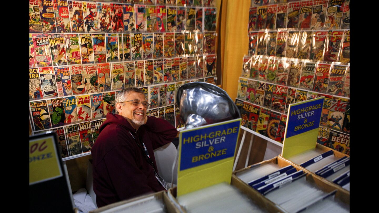 Ted Vanliew, 58, of Worcester, Mass., sits in the middle of his comic book collection inside of the exhibition hall during the second day of Comic-Con. Vanliew has been collecting comic books for 29 years.