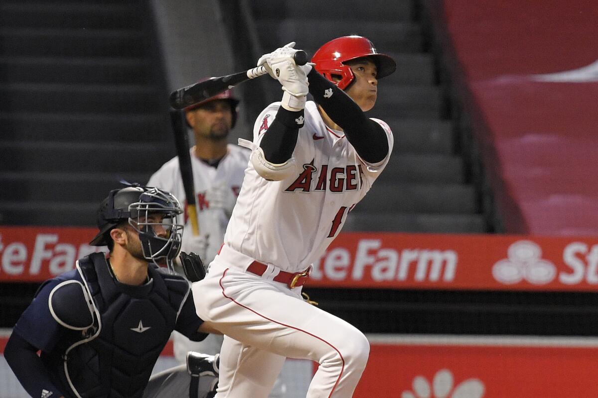 Angels' Shohei Ohtani follows through on a swing during an at-bat