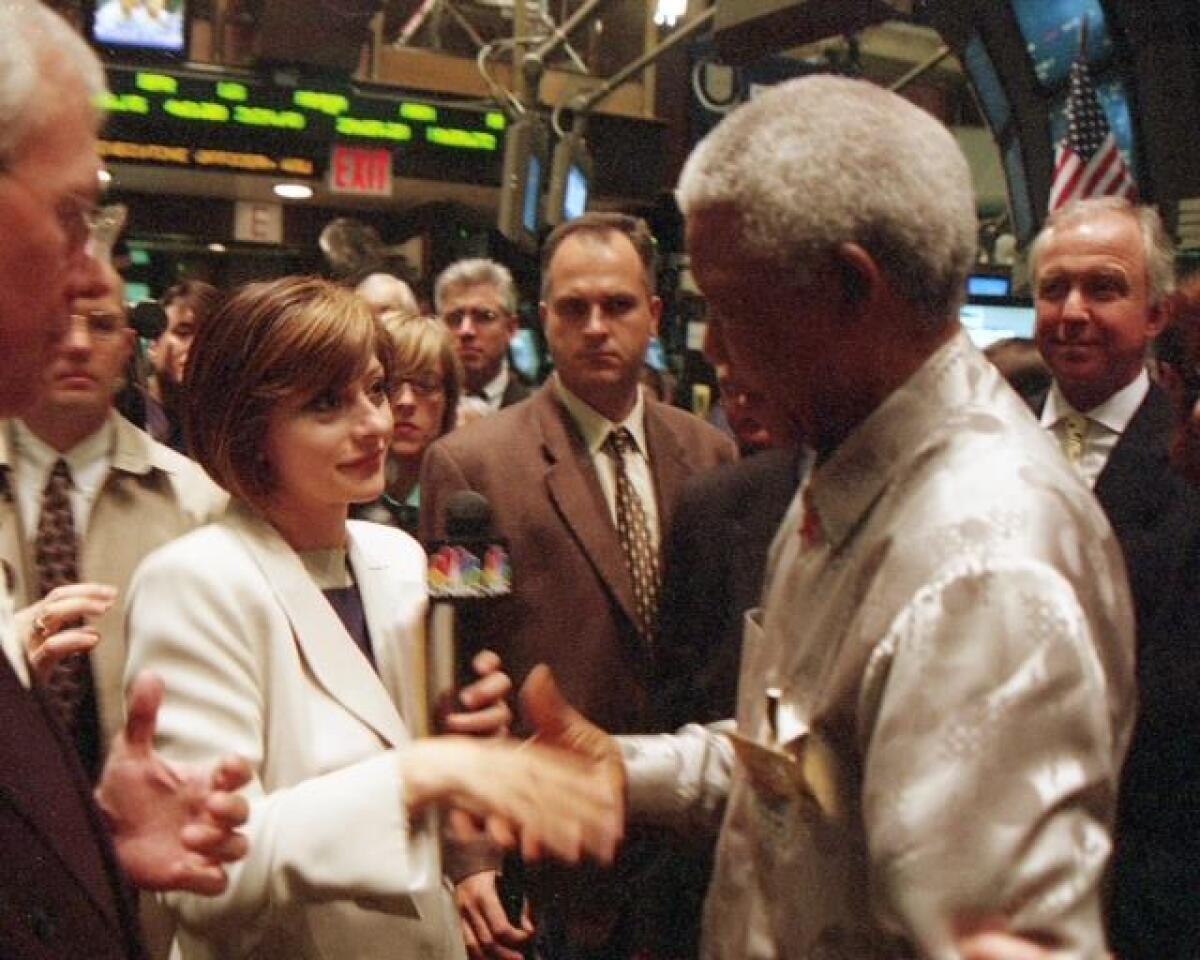 A file photo of Maria Bartiromo on the New York Stock Exchange floor with Nelson Mandela.