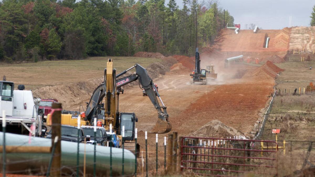 Crews clear a route in preliminary construction work for the proposed Keystone XL pipeline near Winona, Texas.