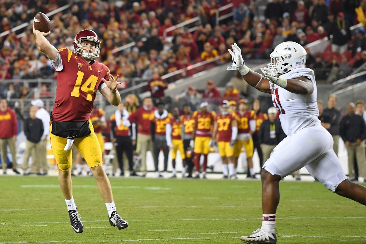 Sam Darnold #14 of the USC Trojans looks to throw a pass against the Stanford Cardinal 