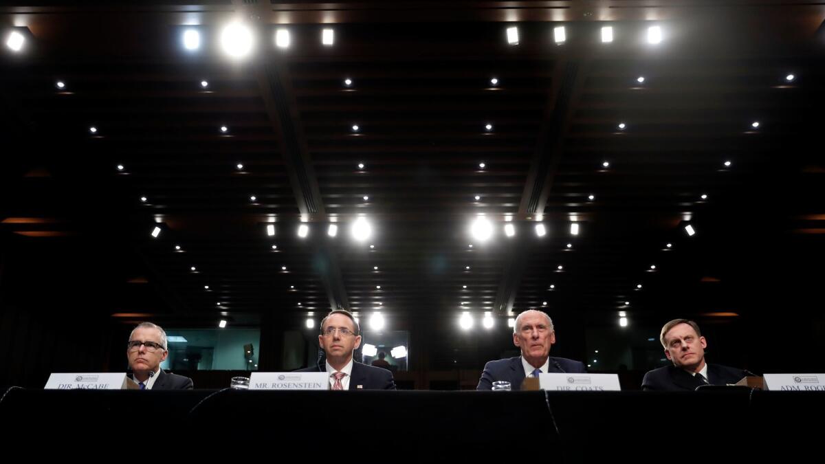 FBI acting director Andrew McCabe, Deputy Attorney General Rod Rosenstein, Director of National Intelligence Dan Coats, and National Security Agency director Adm. Mike Rogers are seated during a hearing about the Foreign Intelligence Surveillance Act in Washington, on June 7.