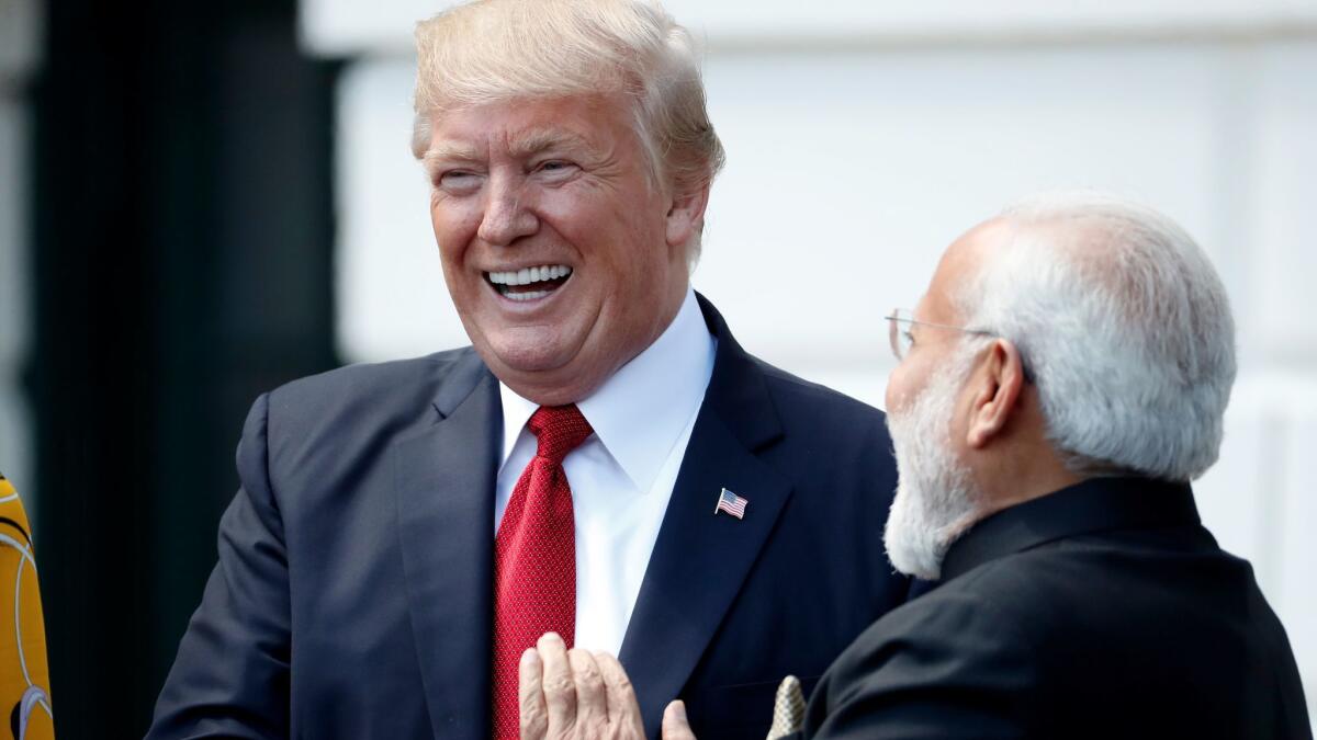 President Trump and Indian Prime Minister Narendra Modi share a laugh at the White House on June 26.