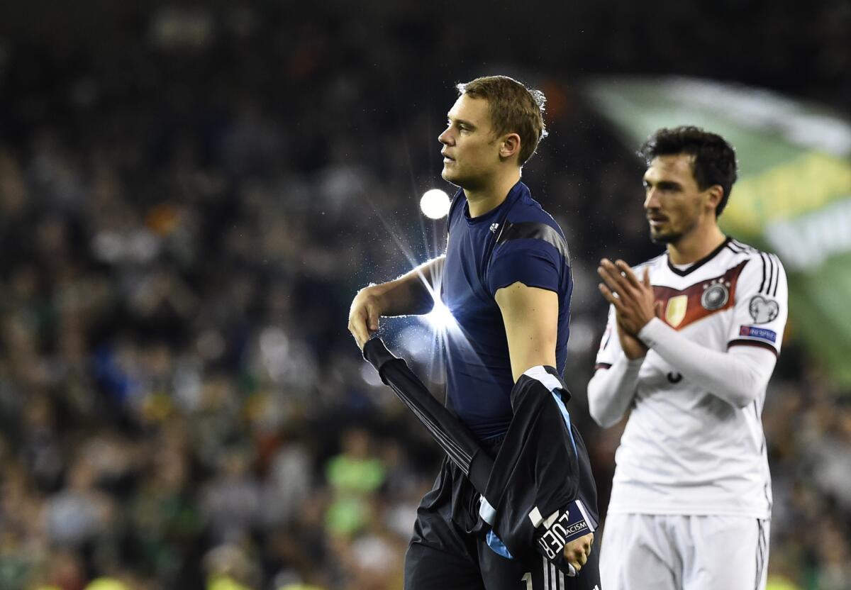 Germany goalkeeper Manuel Neuer and defender Mats Hummels, right, walk from the pitch after losing a UEFA Euro 2016 Group D qualifying match to Ireland on Oct. 8.