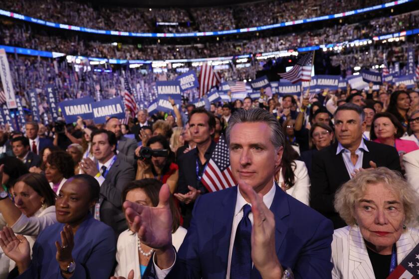 CHICAGO, IL AUGUST 22, 2024 - Gov. Gavin Newsom applauds during the Democratic National Convention Thursday, Aug. 22, 2024, in Chicago, IL. (Robert Gauthier/Los Angeles Times)