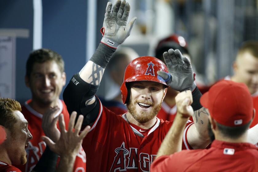 Josh Hamilton, shown celebrating a solo home run with his Angels teammates in August, might have many supporters within the organization, but owner Arte Moreno doesn't seem to be one of them.