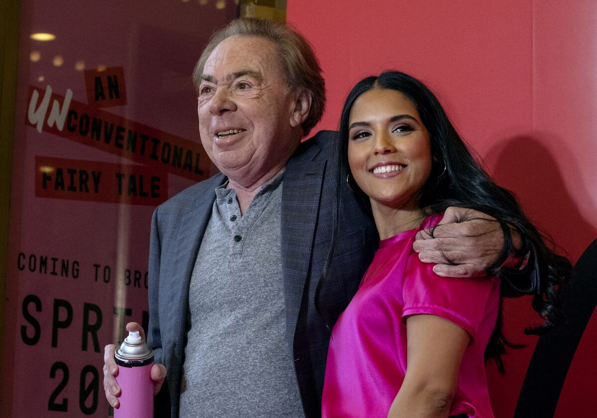 Composer Andrew Lloyd Webber stands with Linedy Genao, who will star in his production "Bad Cinderella," as an announcement was made about the new production Monday, Oct. 3, 2022, at the Imperial Theatre in New York. (AP Photo/Craig Ruttle)