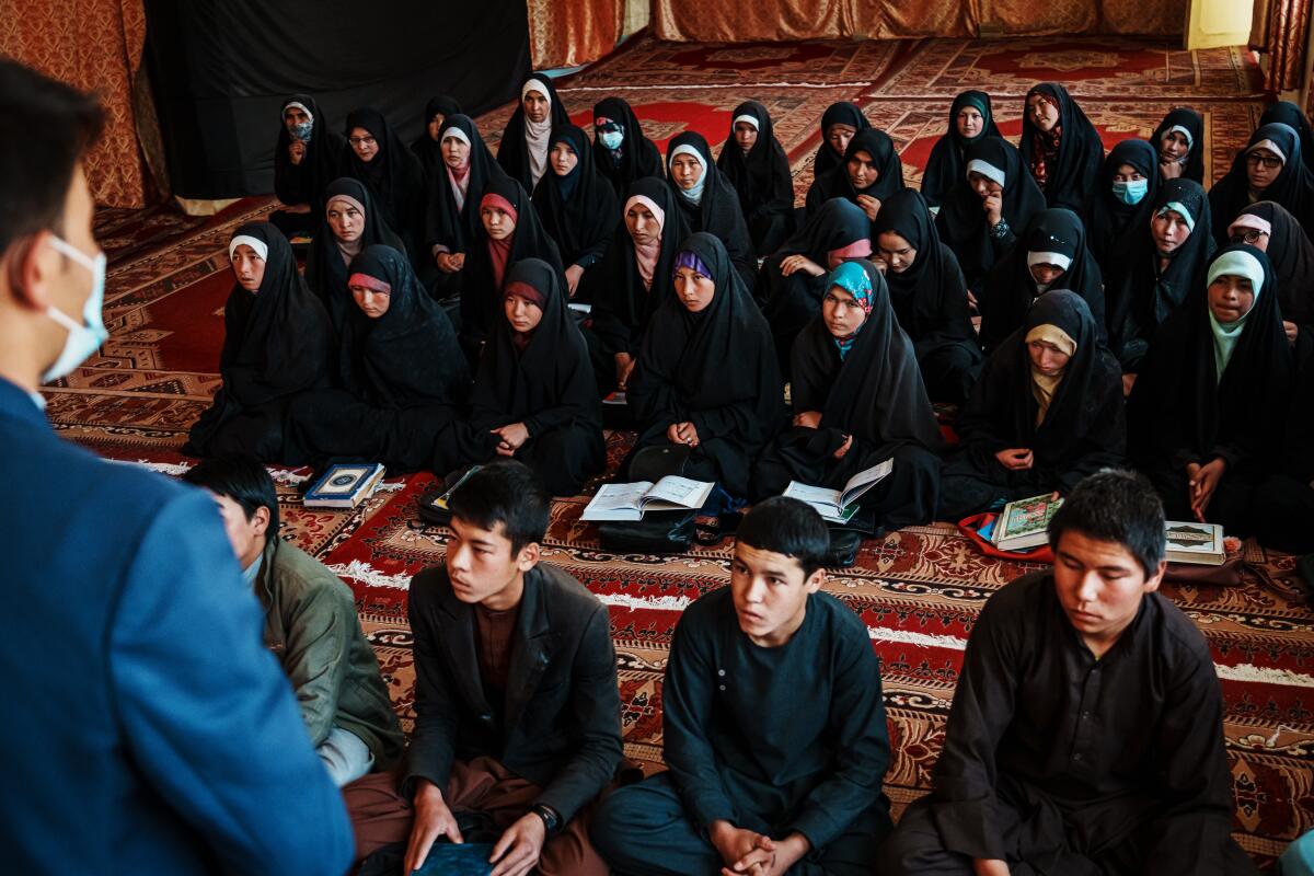 Afghan girls attending a religious school