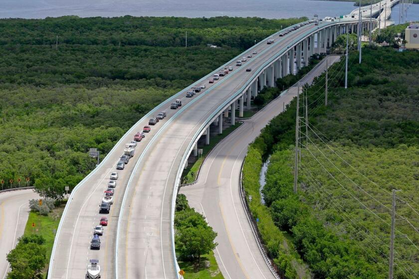 Motorists head north on US 1, Wednesday, Sept. 6, 2017, north of Key Largo, Fla. Keys officials announced a mandatory evacuation Wednesday for visitors, with residents being told to leave the next day. (AP Photo/Alan Diaz)