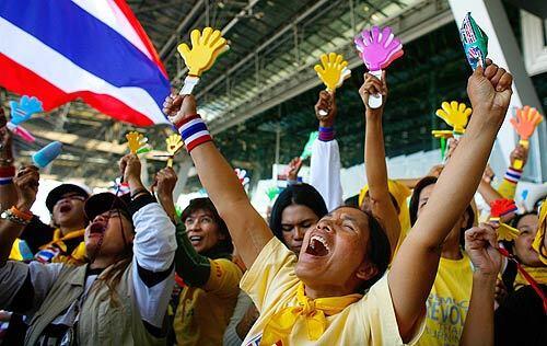 Demonstrators from the People's Alliance for Democracy cheer at the end of their occupation of Suvarnabhumi international Airport in Bangkok, Thailand, after a court dissolved Thailand's top three ruling parties for electoral fraud and banned the prime minister from politics for five years. Cargo flights to the airport have resumed, but passenger traffic is not expected to resume until Dec. 15 as the country struggles through its political crisis.