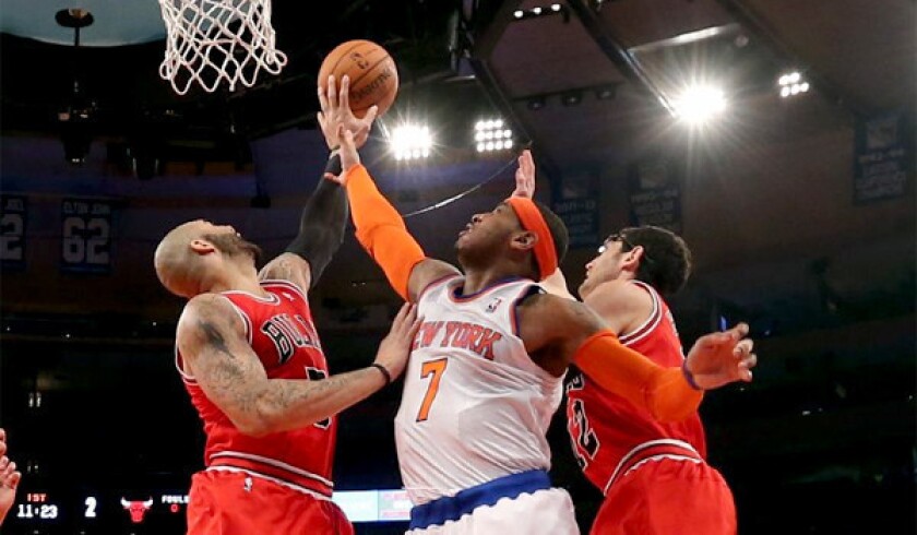 Nicks forward Carmelo Anthony is blocked in the first half of a loss to the Chicago Bulls, 110-106.