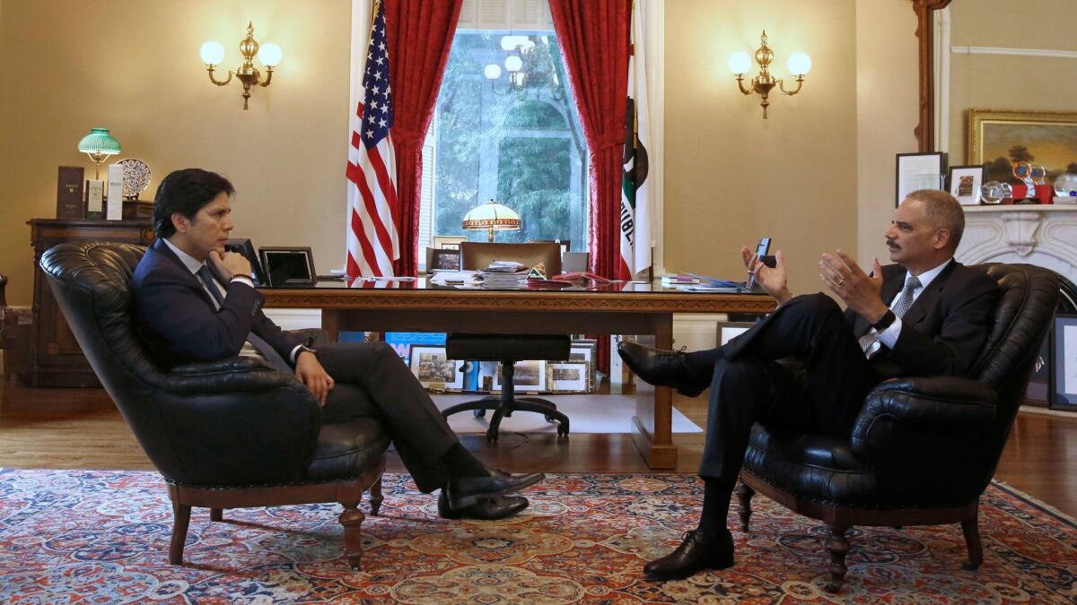 Senate President Kevin de Leon (D-Los Angeles), left, meets with former U.S. Atty. Gen. Eric Holder in Sacramento.