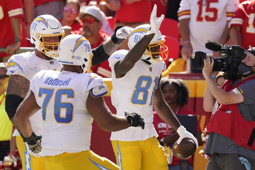 Los Angeles Chargers' Mike Williams (81) celebrates a touchdown reception during the second half,