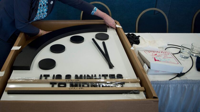 The Doomsday Clock is seen after members of the Bulletin of the Atomic Scientists moved it 30 seconds closer to midnight on Jan. 25 in Washington.