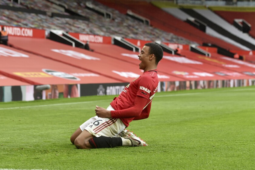 Manchester United's Mason Greenwood celebrates after scoring a goal during the English Premier League soccer match between Manchester United and Bournemouth at Old Trafford stadium in Manchester, England, Saturday, July 4, 2020. (Peter Powell/Pool via AP)