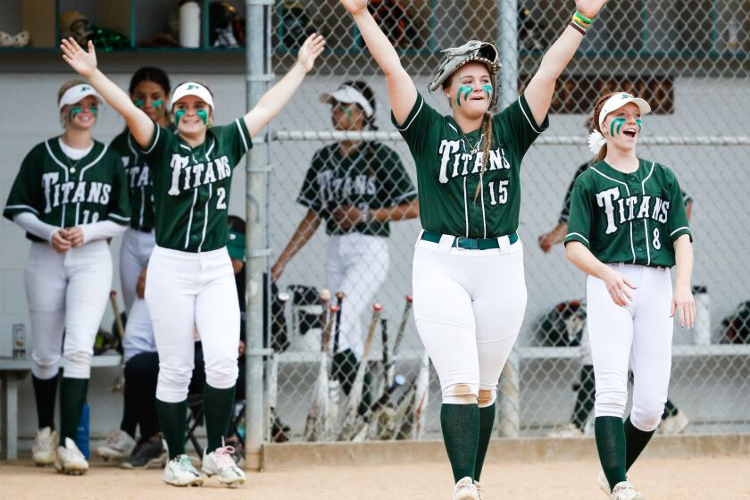 Poway, CA - June 01: Poway's Sophia Burmeister (15), center, and teammates celebrate beating Torrance during the CIF-Southern California regionals at the school on Thursday, June 1, 2023 in Poway, CA.(Meg McLaughlin / The San Diego Union-Tribune)
