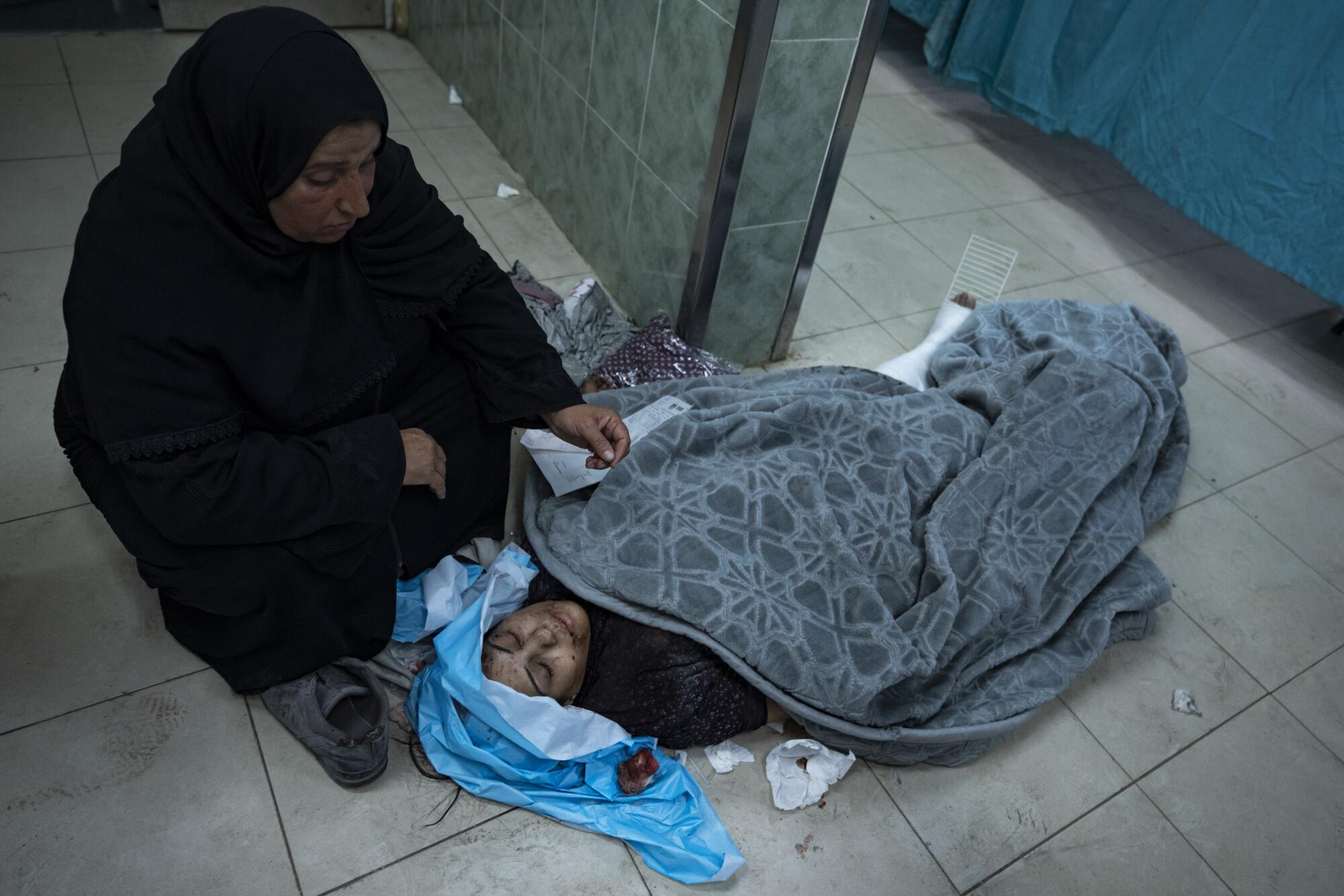 Wounded Palestinian awaiting treatment at a hospital in Rafah, Gaza