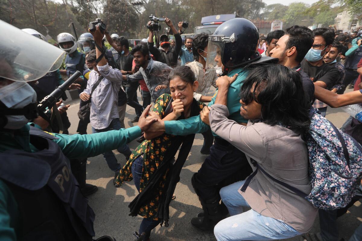 Bangladeshi students clash with police during a protest in Dhaka, Bangladesh, Monday, March 1, 2021. About 300 student activists rallied in Bangladesh’s capital on Monday to denounce the death in prison of Mushtaq Ahmed, a writer and commentator who was arrested last year on charges of violating a sweeping digital security law that critics say chokes freedom of expression. (AP Photo/Mahmud Hossain Opu)