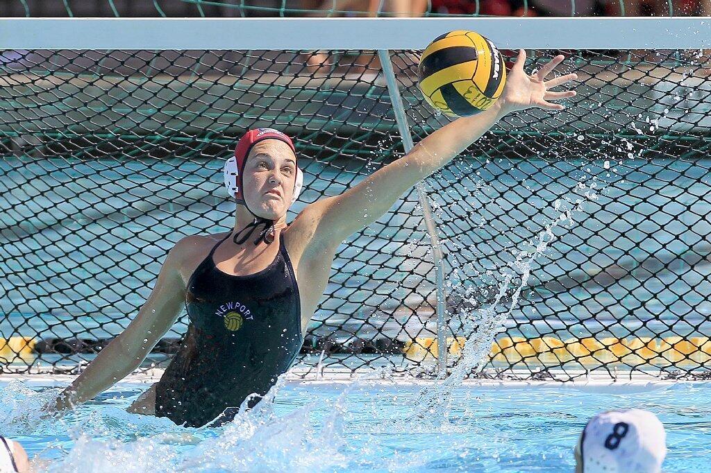 Newport Water Polo Foundation goalie Cleo Harrington gets up for one of her career-high 23 saves against the United Water Polo Club in a USA Water Polo Junior Olympics match at Capistrano Valley High in Mission Viejo on Thursday.