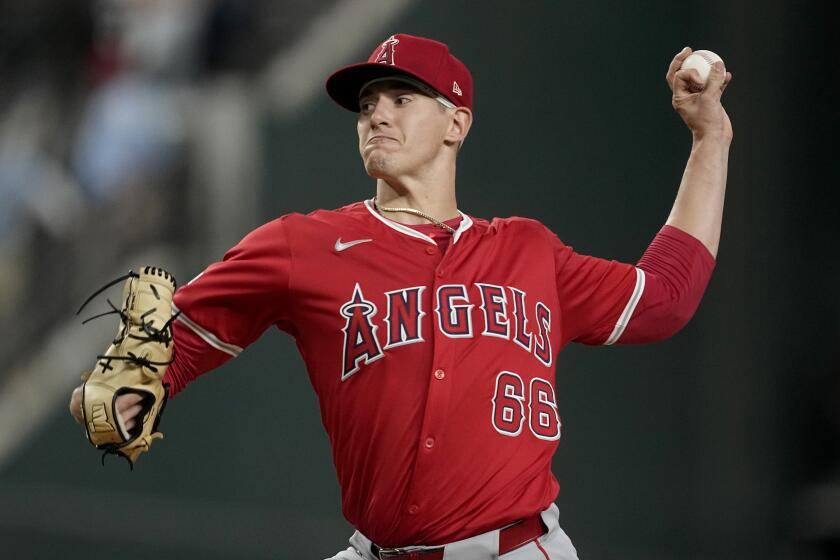 Los Angeles Angels starting pitcher Samuel Aldegheri throws to the Texas Rangers.