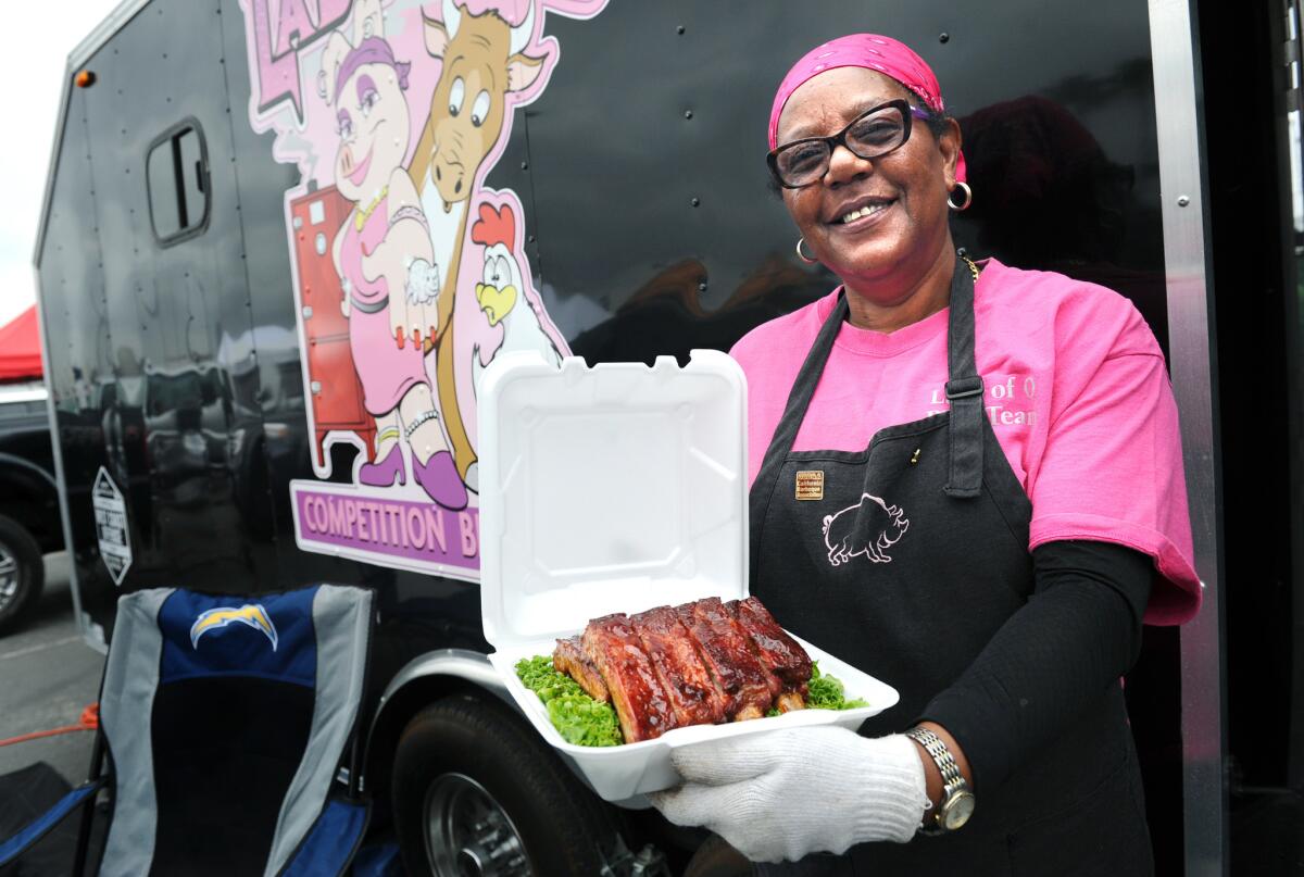 Sylvie Curry (Lady of Q) holds ribs that she is entering in a BBQ contest at the Queen Mary in Long Beach.
