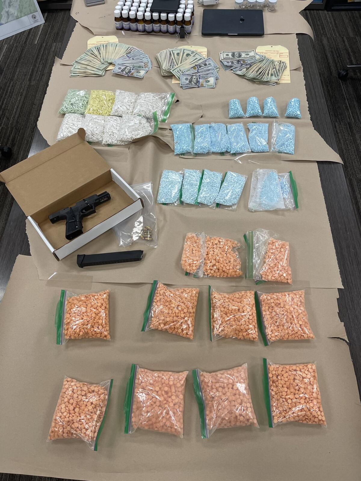 Roughly 50,000 fentanyl pills, an unspecified amount of cash, a “ghost” gun and a high-capacity magazine.