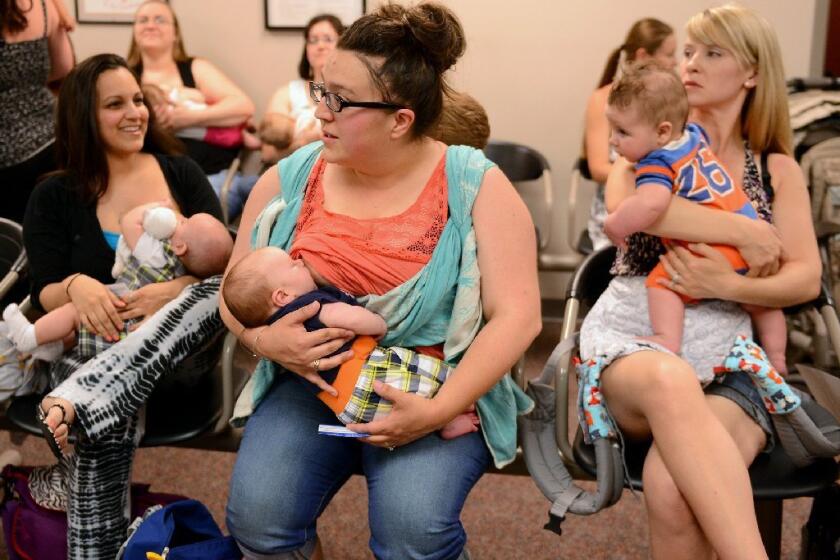 Mothers nurse their babies in Lansing, Mich. A new study finds that children who were breast-fed for any amount of time were less likely to develop leukemia than children who never nursed.