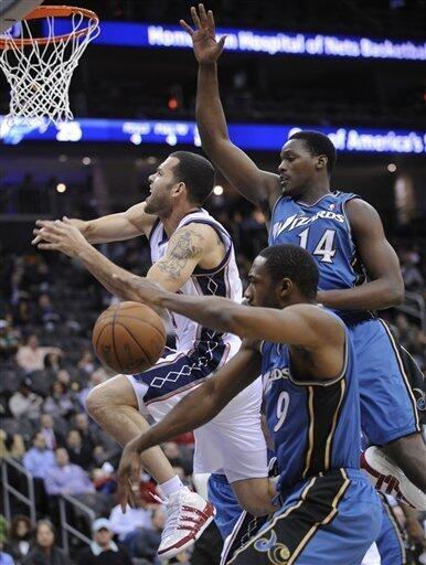 New Jersey Nets Brook Lopez (11) slam dunks over Washington