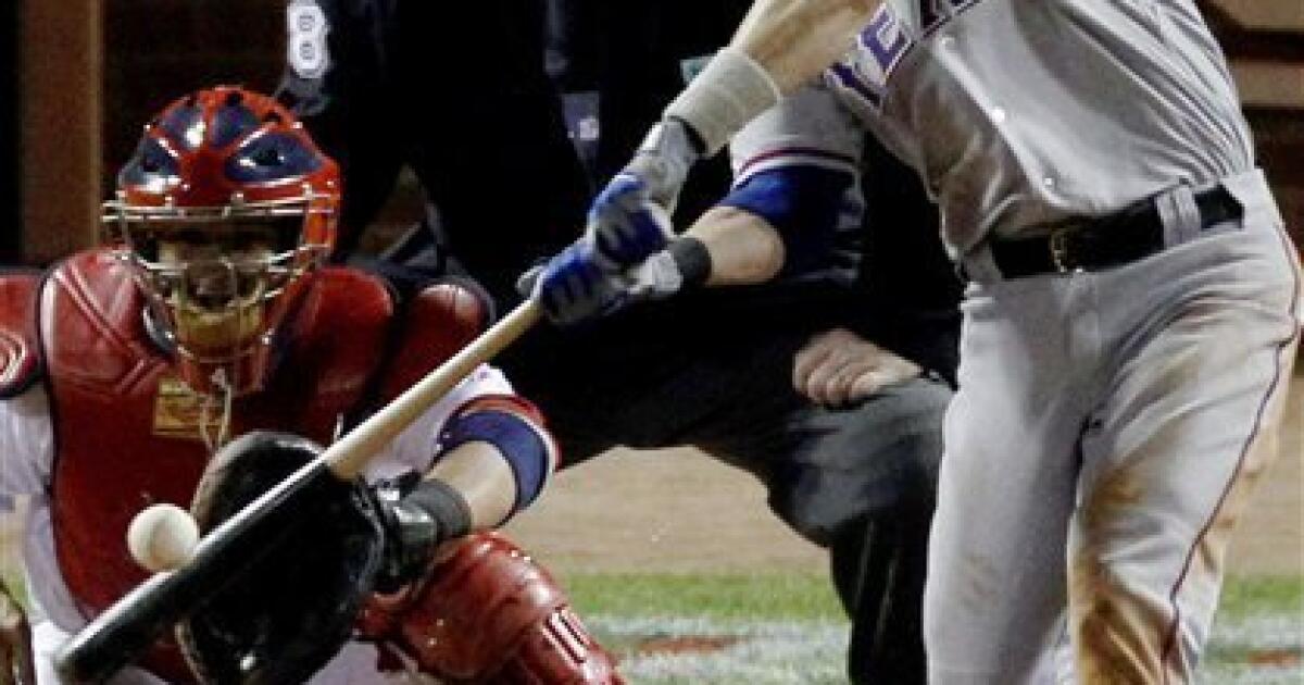 Texas Rangers' Mike Napoli breaks hits bat while grounding out