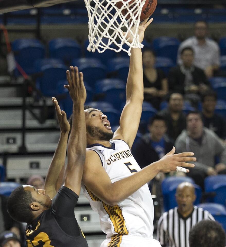 UC Irvine's Jonathan Galloway lays it up and in against Long Beach State.