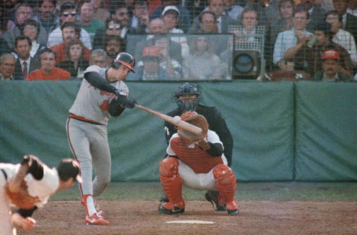 Angels first baseman Wally Joyner hits a home run off Boston Red Sox pitcher Bruce Hurst during Game 2 of the 1986 ALCS.