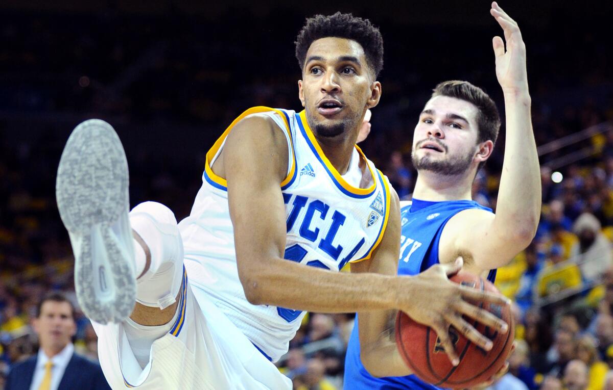 UCLA's Jonah Bolden steals the ball form Kentucky's Isaac Humphries in the first half at Pauly Pavillion on Dec. 3, 2015.