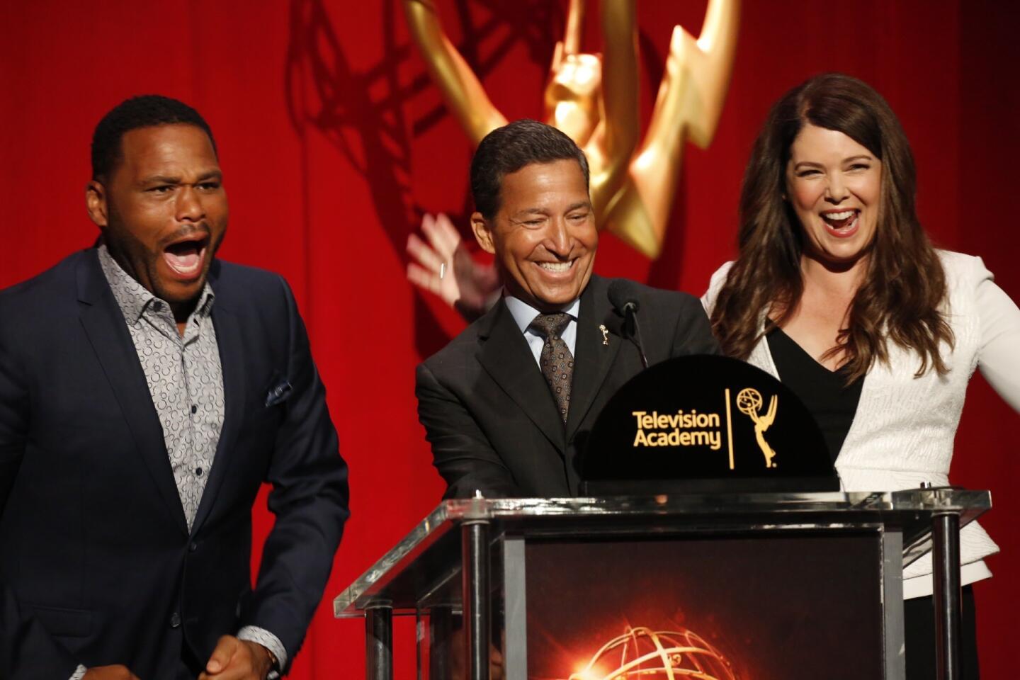 Anthony Anderson, left, reacts with Television Academy Chairman Bruce Rosenblum and Lauren Graham to the nomination of "black-ish" for the Emmy in a comedy series.