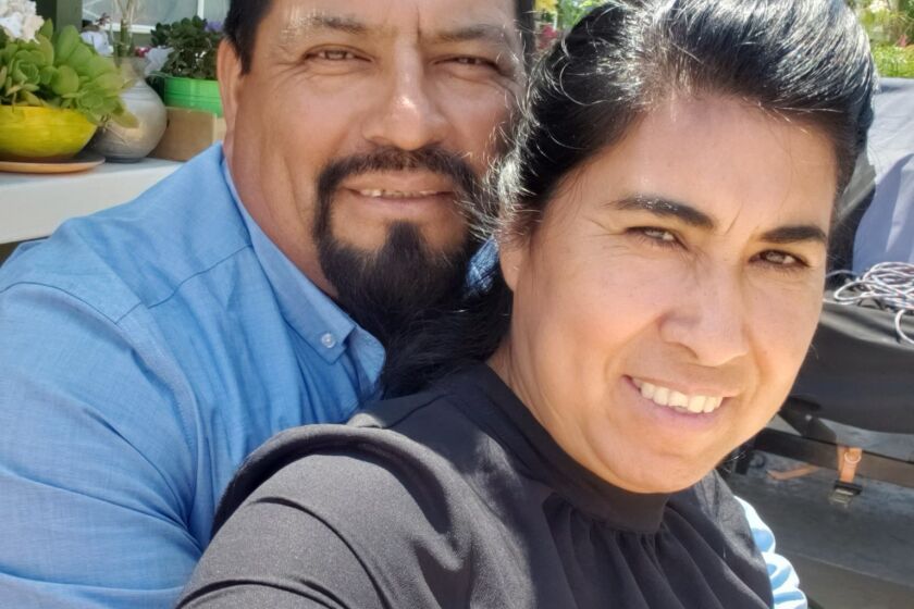 San Bernardino County man Javier Calderon, 49, is shown here in the family's backyard with his wife Teresa. Calderon, a rebar installer, was identified late Wednesday evening as the man who was killed at a construction site in Pacoima by a collapsing wall earlier that day.