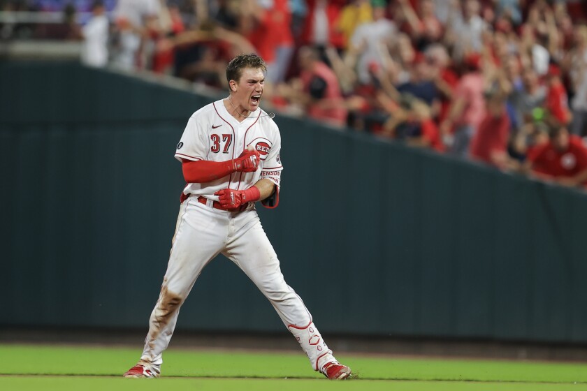 Cincinnati Reds' Tyler Stephenson yells after driving in the winning run with a single during the ninth inning of the team's baseball game against the San Diego Padres in Cincinnati, Thursday, July 1, 2021. The Reds won 5-4. (AP Photo/Aaron Doster)