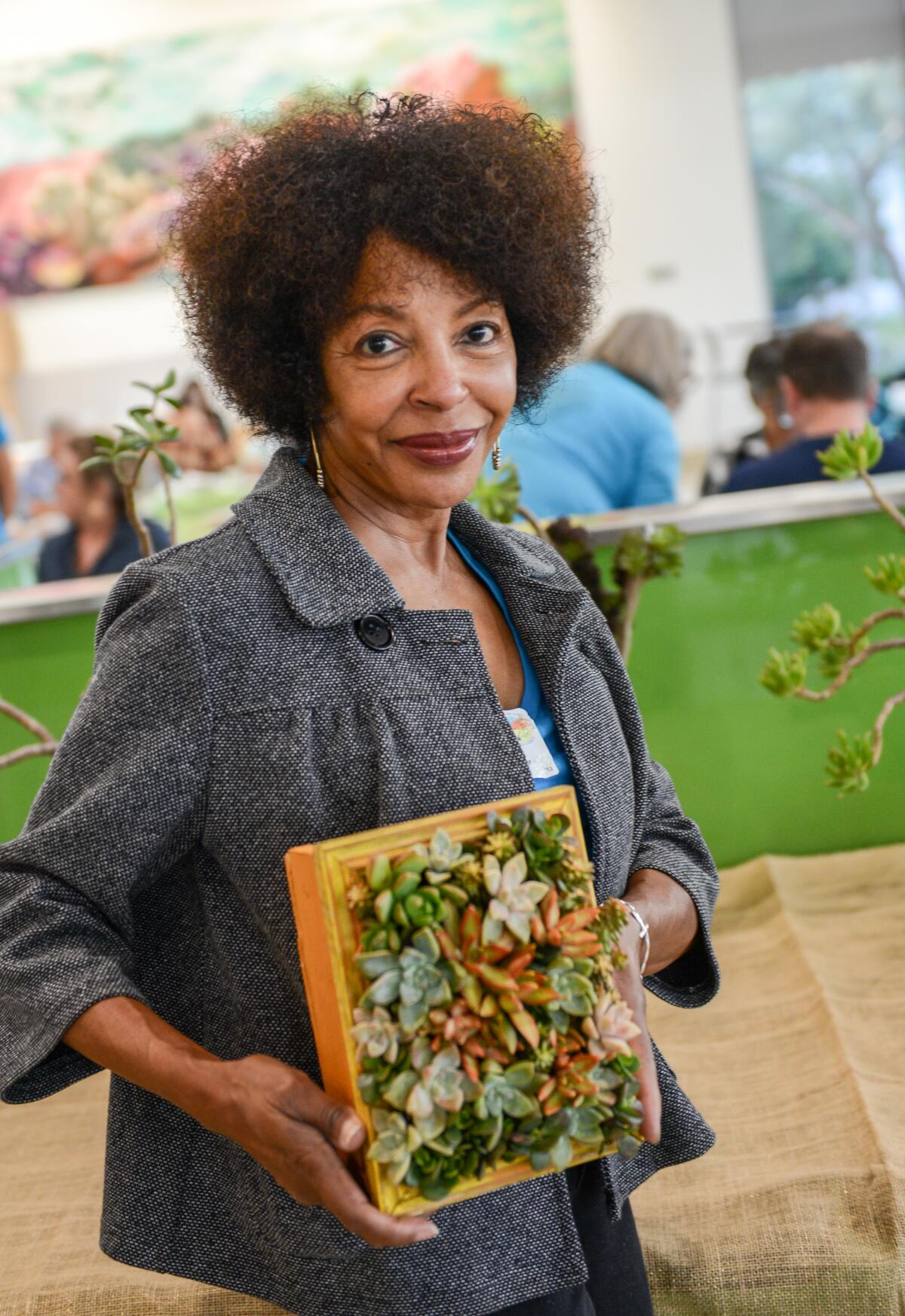 Master Gardener Muriel King displays a succulent board at the 2023 event. The expo will include a variety of crafts.