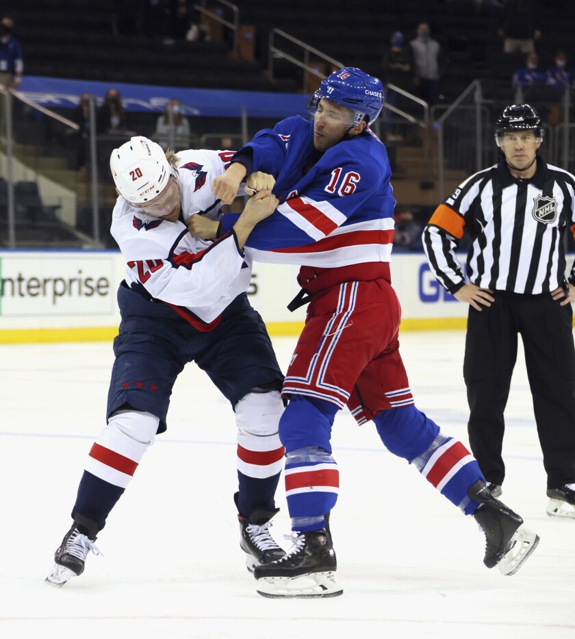 New York Rangers' Ryan Strome (16) fights with Washington Capitals' Lars Eller (20) during the first period of an NHL hockey game Wednesday, May 5, 2021, in New York. (Bruce Bennett/Pool Photo via AP)