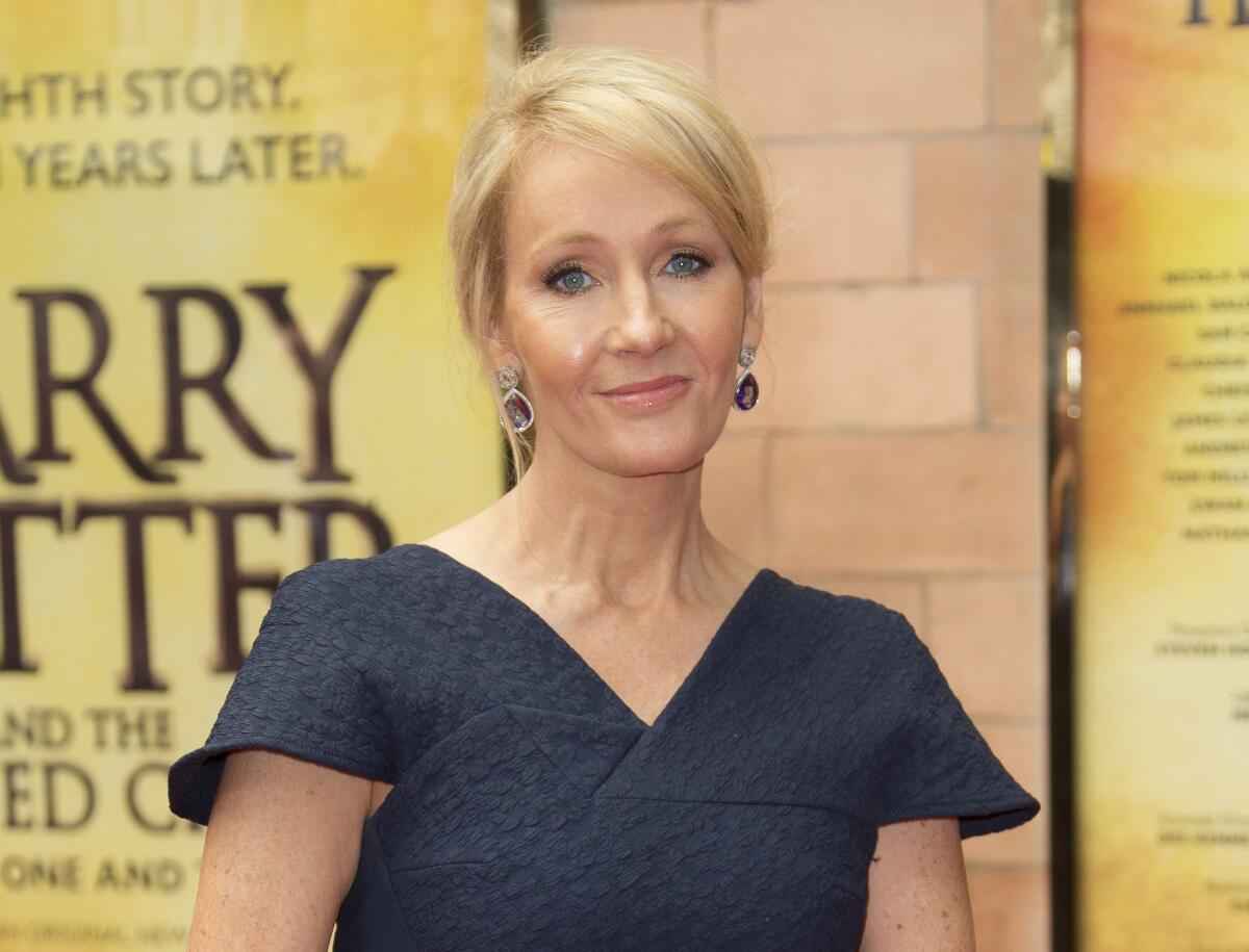 FILE - In this July 30, 2016, file photo, writer J.K. Rowling poses for photographers upon arrival at gala performance of "Harry Potter and the Cursed Child," in central London.