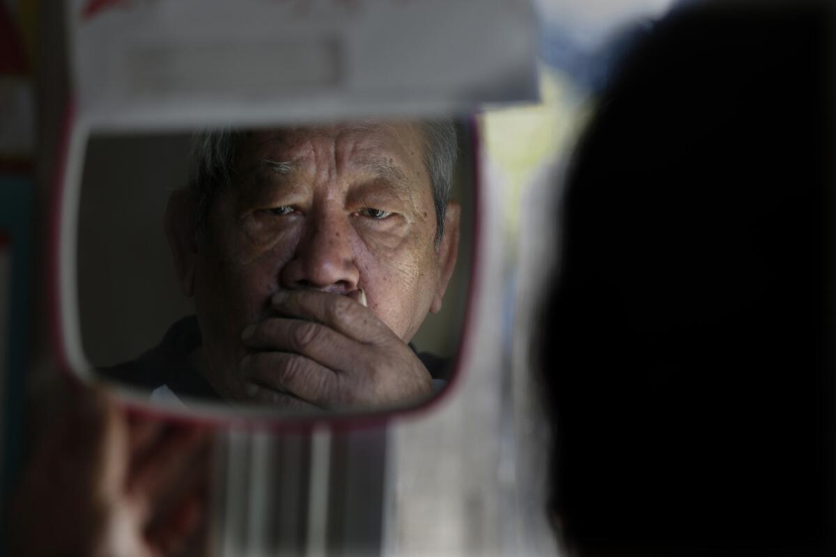 Long Ma in his room at a boarding house in Garden Grove.