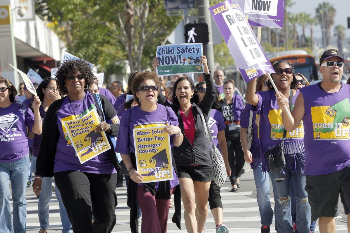 Service Employees International Union members protest for higher wages in downtown Los Angeles on Oct. 1, 2013.