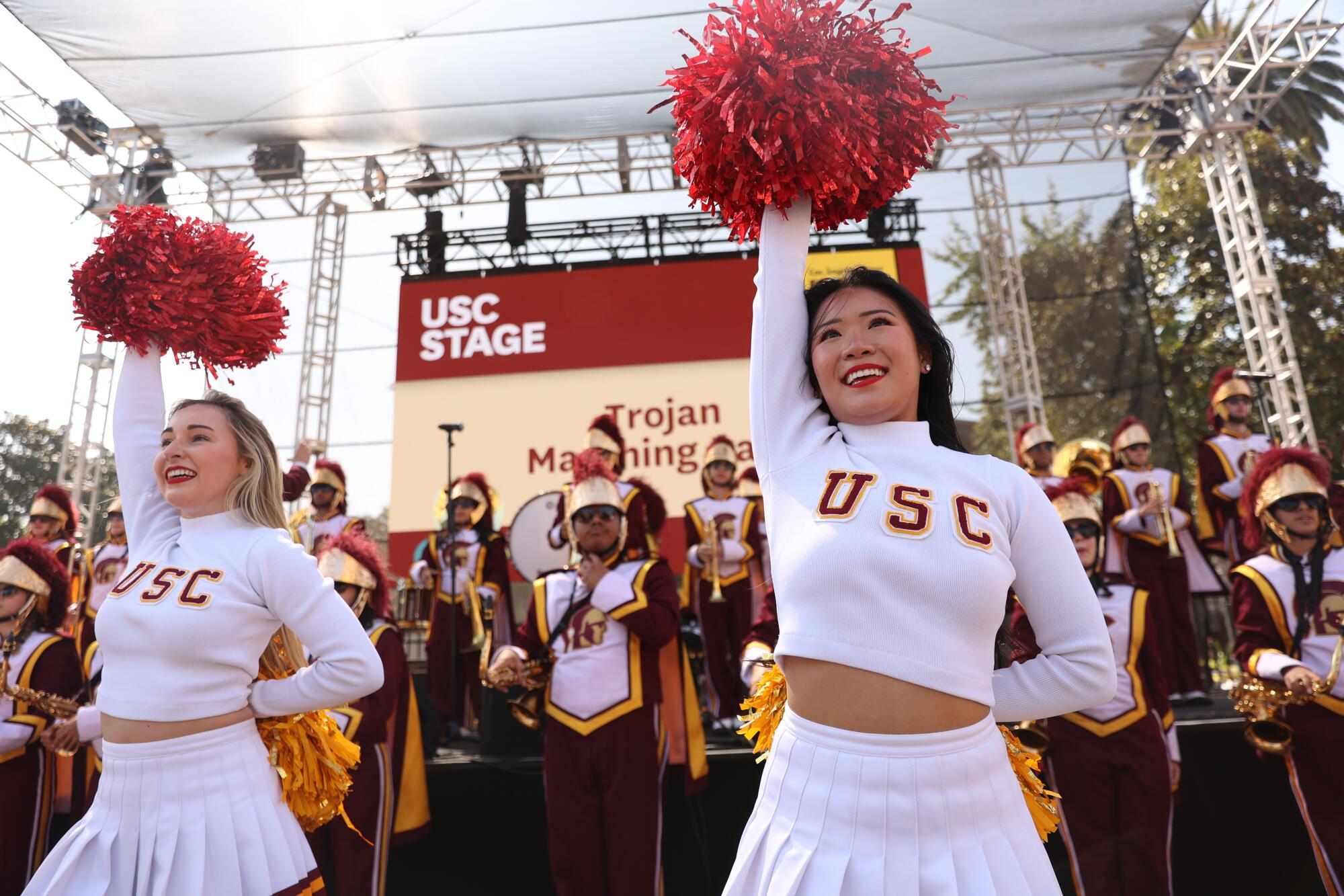 USC cheerleaders and band members perform during the LA Times Book Festival.