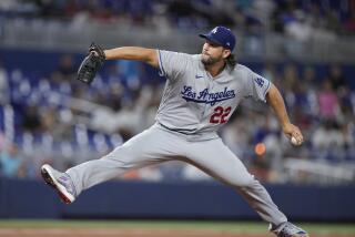 Los Angeles Dodgers' Clayton Kershaw delivers a pitch during the first inning.