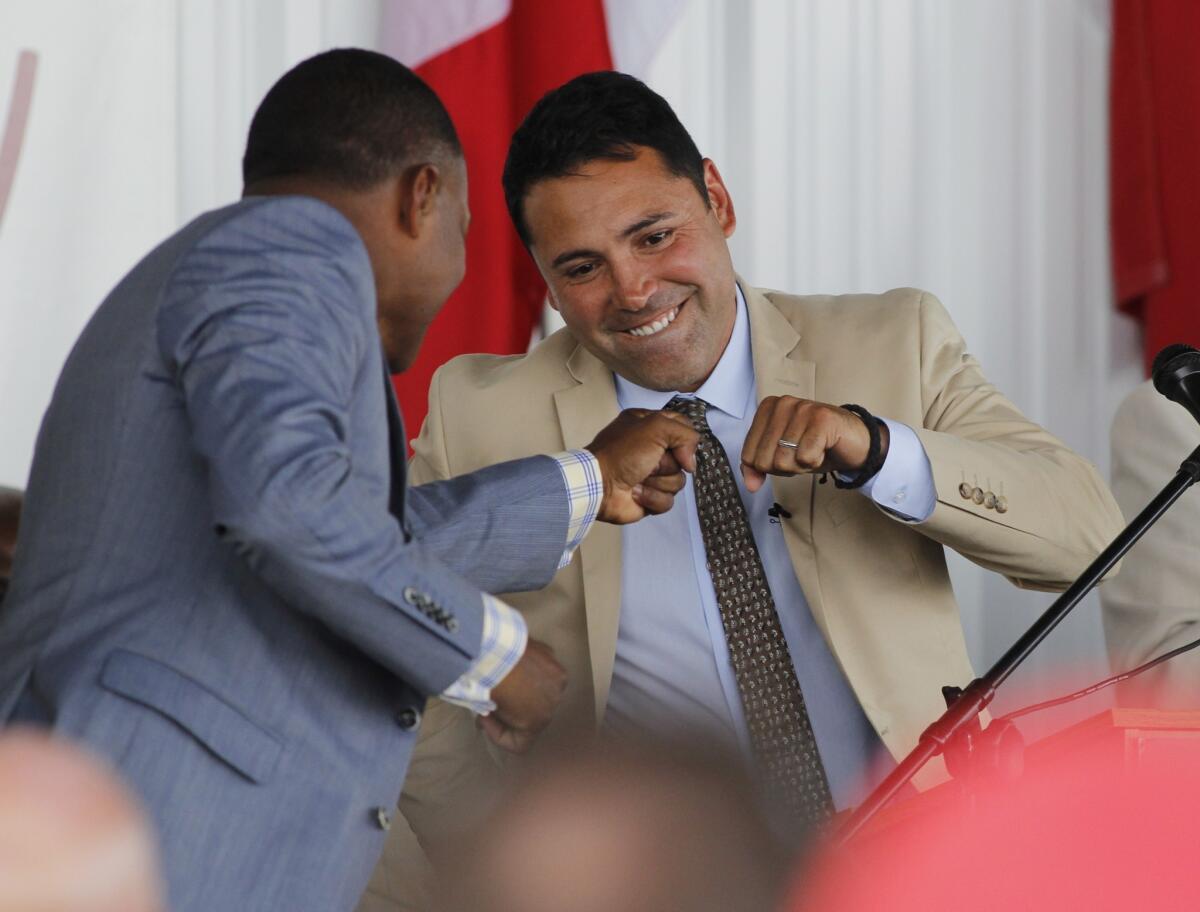 International Boxing Hall of Fame inductee Oscar De La Hoya, right, congratulates fellow inductee Felix Trinidad during an induction ceremony in Canastota, N.Y. on June 8.