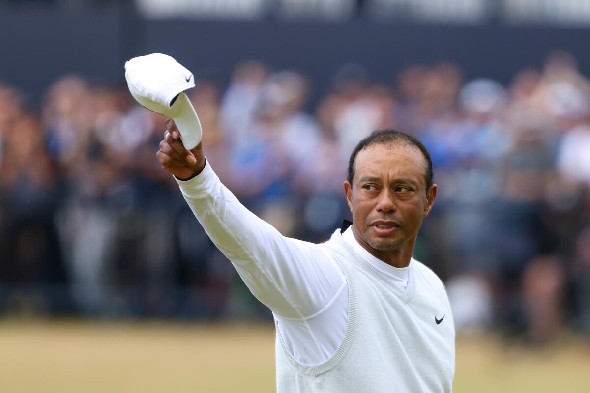 Tiger Woods raises his cap to the crowd at the end of his second round at the British Open 